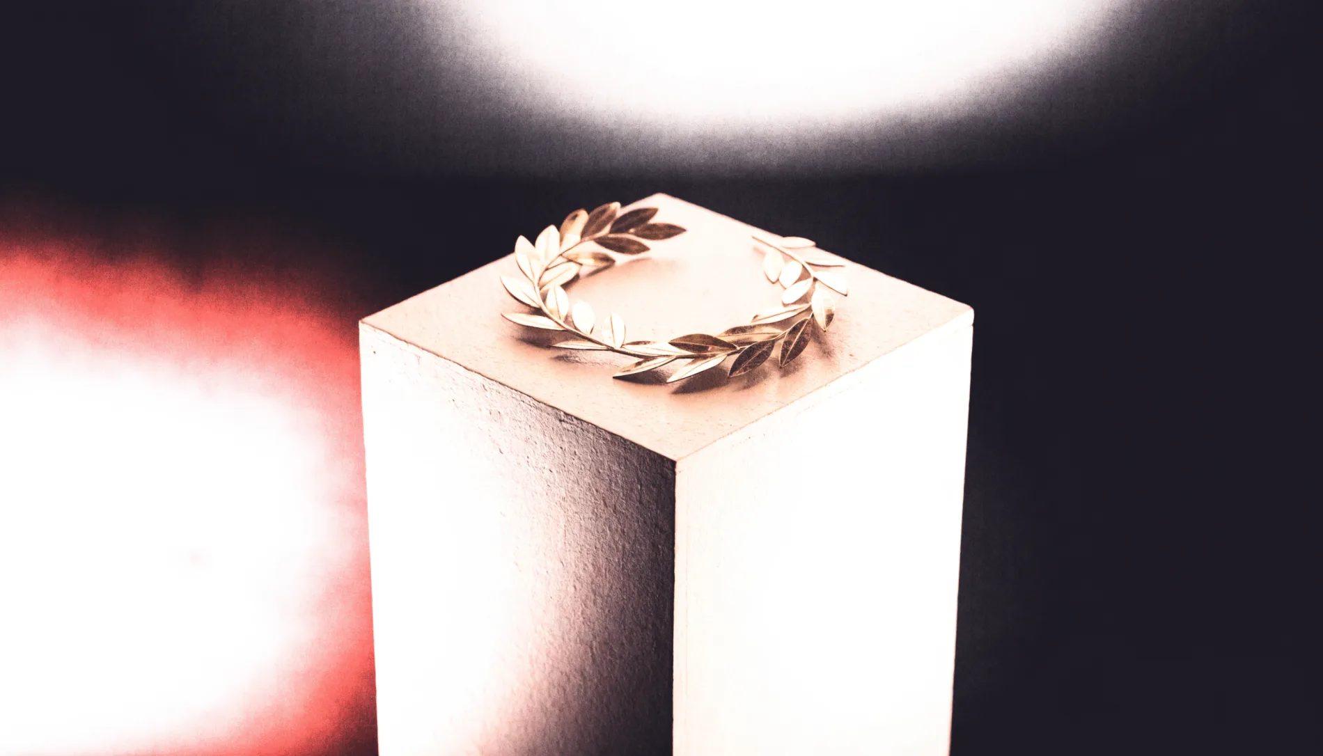 Golden laurel wreath on a pedestal