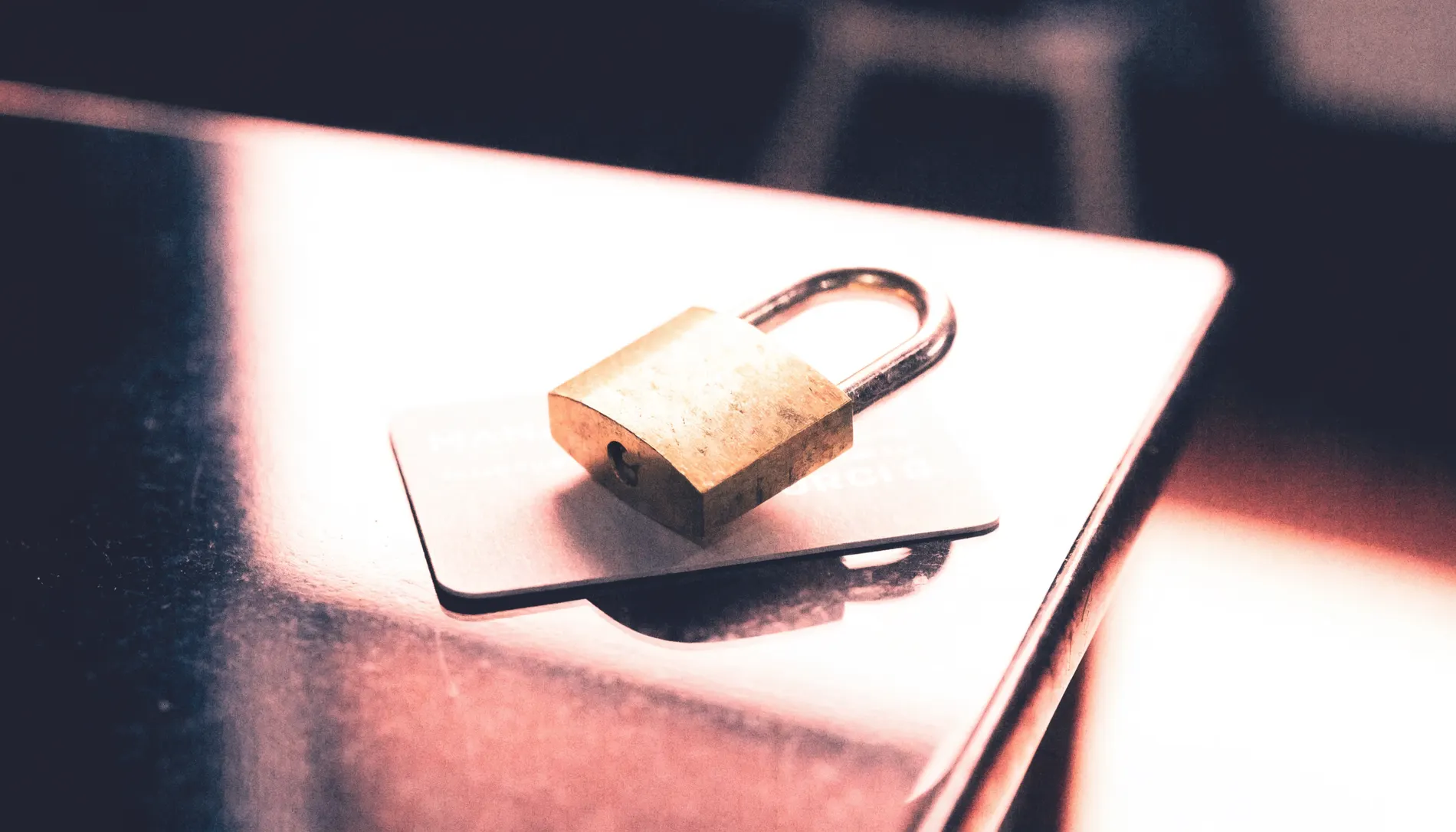 A small padlock resting on a plain card